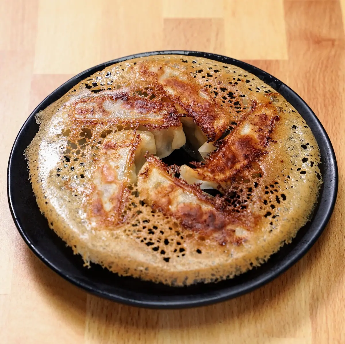 Pan-Fried Gyoza - Crispy pan-fried dumplings filled with pork and chicken, served in 5 pieces